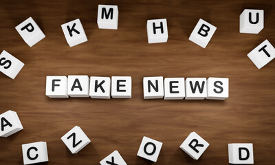 Fake News - Wrong information. White dice with dark capital letters on a table. Propaganda, lies and manipulation concept. 3D illustration