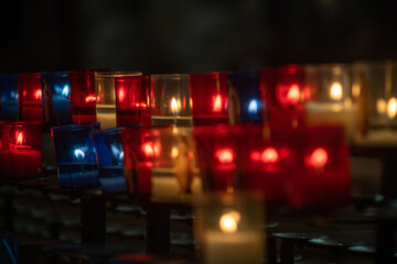Closeup of prayer candles in a church