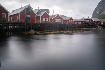 Obraz premium Red fishermen cabins in the fishing village of Reine in Lofoten islands, Norway