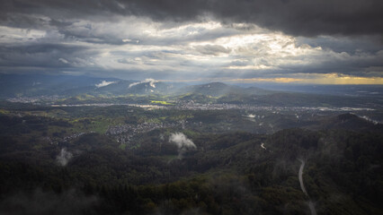 The sun breaks through the cloud cover and shines on the beautiful Murg Valley in the German Black Forest