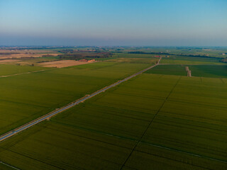 Aerial farmland landscape in Po valley in Italy at sunset