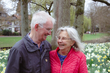 Smiling retired couple in park