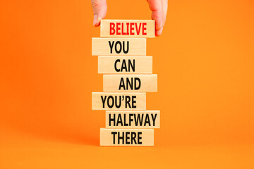 You can symbol. Concept words Believe you can and you are halfway there on wooden blocks on a...