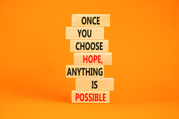 Hope and anything is possible symbol. Concept words Once you choose hope anything is possible on wooden blocks on a beautiful orange table orange background. Business and hope concept. Copy space