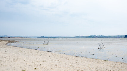 Empty football yard in the beach during low tide. Brittany, France