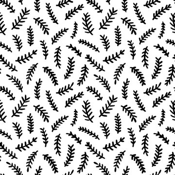 Seamless pattern with Christmas tree branches. Black winter plants hand-painted with a brush. Nature illustration with simple Christmas plants in naive art style. Vector black ink ornament.