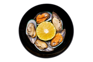mussels on a platter with lemon on a white background top view