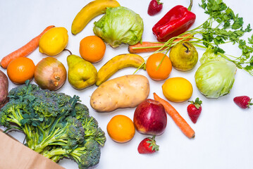 healthy food, fruits and vegetables in a shopping bag. vegetarian. close up