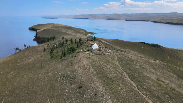Aerial view of Ogoy Island. Summer landscape of Lake Baikal. Buddhist Stupa of Enlightenment. Famous tourist spot in Eastern Siberia.
