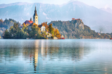 Fabulous sunny day view of popular tourist destination  Bled lake.