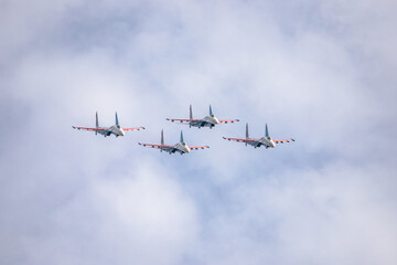 a group of military aircraft in combat formation