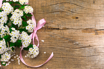 Flowers with a pink ribbon
