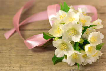 Bouquet of jasmine on a wooden table