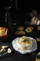 Baked Camembert cheese with rosemary and garlic
