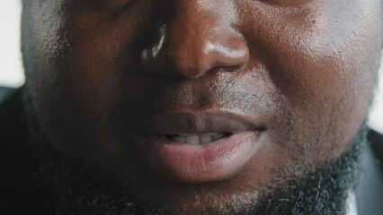 Close up african male face portrait of bearded plus size man client businessman speaker blogger talking to camera recording video instruction interview blog saying motivational speech teaching online