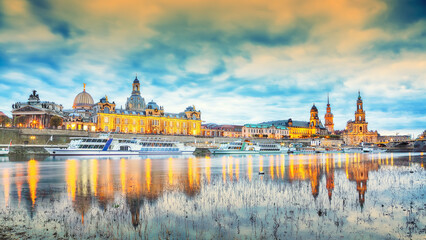 Sunset on Elbe river with panorama of Cathedral of the Holy Trinity or Hofkirche, Bruehl's Terrace or The Balcony of Europe
