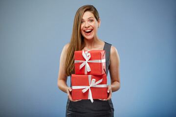 Happy business woman holding red gift boxes.