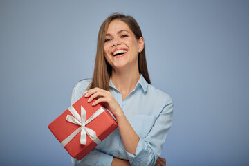 Happy woman holding gift box. Isolated female portrait.