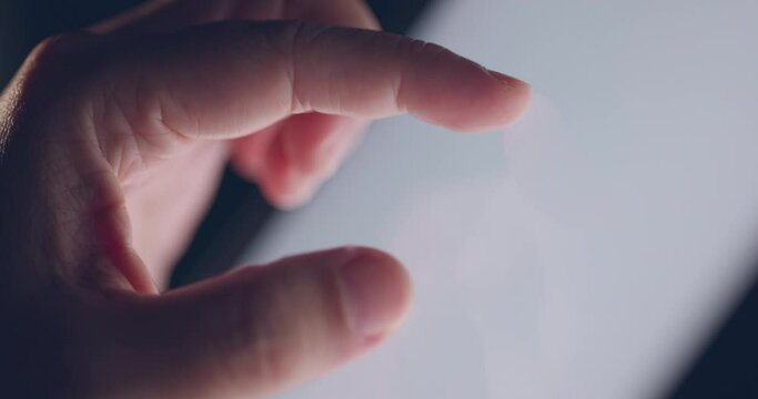 4K Video slow motion close up finger touch on tablet screen. Video Background for technology and digital life.