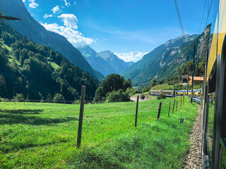 Beautiful summer mountain view on Swiss Alps Swiss railway