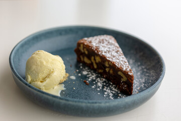 For dessert, a chocolate brownie and a scoop of vanilla ice cream