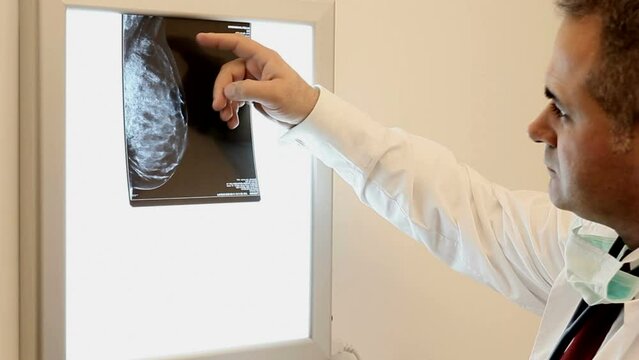 doctor examining a breast