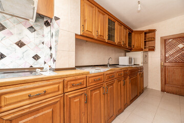 Kitchen with rustic vintage wooden furniture along one wall