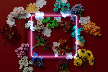 a square neon frame on top of flowers background