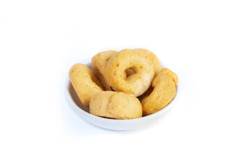 Tarallini or Taralli an Italian Snack Ring or Cracker Isolated on White in a Small White Bowl in a Three Quarter or Side View Shot