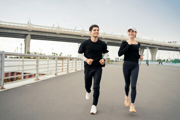 Fototapeta premium Friends runners fitness training in sportswear, running in sneakers.