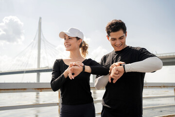 Look at the fitness watch friends runners fitness workout. People athletes are happy preparing for...