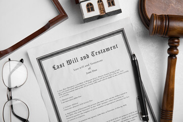 Last will and testament near house model, glasses, gavel on white table, flat lay
