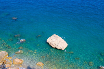 Very beautiful background or backdrop of sea water with rocky shore, selective focus