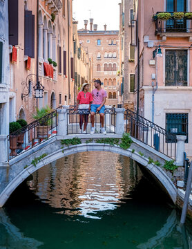 A young couple on a city trip in Venice Italy, men and women visit Venice Italy