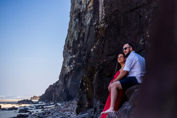 Photo of pregnant couple sitting outdoors