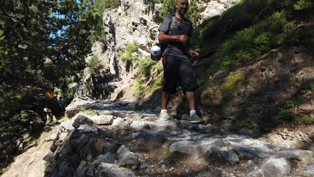 Man happily hiking in Samaria Gorge