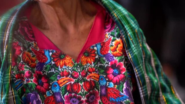 Tilting shot of mayan woman in market. Senior native woman of Guatemala