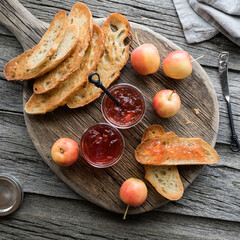 Top down view of crab apple jelly served with toasted sourdough bread. 