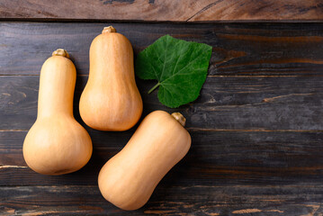 Butternut squash or butternut pumpkin on wooden background, Table top view with copy space