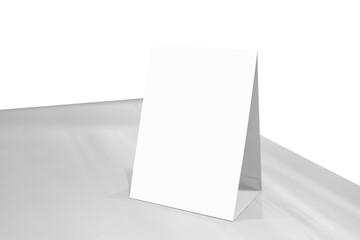 Mock up Label the blank menu frame or or booklets with white sheets paper acrylic tent card on wooden table in Bar restaurant. Can inserting the text of the customer.