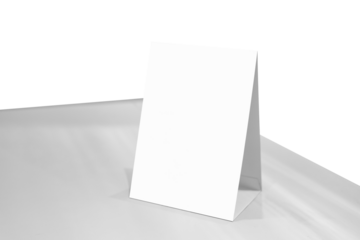 Mock up Label the blank menu frame or or booklets with white sheets paper acrylic tent card on wooden table in Bar restaurant. Can inserting the text of the customer.