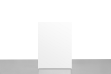 Mock up Label the blank menu frame in shopping mall, Stand for booklets with white sheets paper table cafeteria blurred background can inserting the text of the customer.