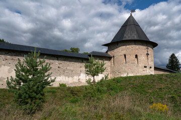 Fototapeta na wymiar View of the Izborsk Tower of the Holy Dormition Pskov-Pechersk Monastery on a sunny summer day, Pechory, Pskov region, Russia