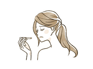 メイクで悩んでいる女性