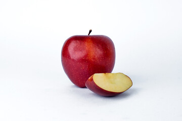 apples and slices on white background