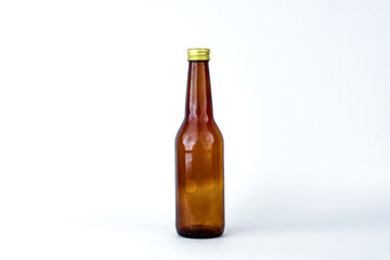 empty brown bottle in the middle with white background