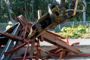 “Large nibbler” attachment for demolition machinery that picks up waste steel frames, demolition work sites, construction industry