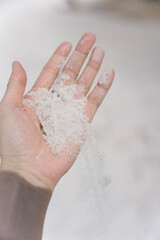Fototapeta premium Hand Holding White Sand