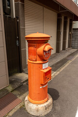 Traditional red postbox in Japan