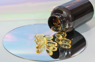 fish oil capsules on a mirror. a bottle with omega 3 oil for heart and vessels health. unsaturated fats for brain boost, cardiovascular supplement